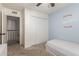 Charming bedroom with baseball decor, closet, and ceiling fan at 1051 S Dobson Rd # 137, Mesa, AZ 85202