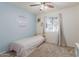 Inviting bedroom with a comfortable bed, large window with curtains, and baseball themed wall art at 1051 S Dobson Rd # 137, Mesa, AZ 85202