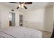 Spacious bedroom with neutral tones, ceiling fan, and plenty of closet space at 1051 S Dobson Rd # 137, Mesa, AZ 85202