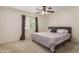 Comfortable bedroom featuring a ceiling fan and window for natural light at 1051 S Dobson Rd # 137, Mesa, AZ 85202
