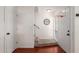 Inviting entryway features hardwood floors, staircase, white walls, and a basketball hoop on door at 1051 S Dobson Rd # 137, Mesa, AZ 85202