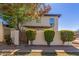 Charming home featuring a textured exterior, lush greenery, and well-maintained landscaping at 1051 S Dobson Rd # 137, Mesa, AZ 85202