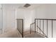 Carpeted hallway featuring a staircase and railing at 1051 S Dobson Rd # 137, Mesa, AZ 85202