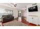 Open living space featuring wood floors, neutral paint, and sliding glass doors at 1051 S Dobson Rd # 137, Mesa, AZ 85202