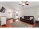 Inviting living room featuring hardwood floors, a ceiling fan, and comfortable sofas at 1051 S Dobson Rd # 137, Mesa, AZ 85202