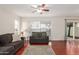 Bright living room with neutral tones, hardwood floors, and sliding glass doors at 1051 S Dobson Rd # 137, Mesa, AZ 85202