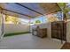 Outdoor patio area with a built-in grill, covered seating, and a privacy fence at 1051 S Dobson Rd # 137, Mesa, AZ 85202