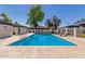 Community swimming pool with chaise lounges and a pergola-covered seating area at 1051 S Dobson Rd # 137, Mesa, AZ 85202