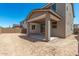 Covered patio with spacious, undeveloped backyard at 11615 W Beck Ave, Youngtown, AZ 85363