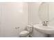 This bathroom has a pedestal sink, white walls, and a toilet at 11615 W Beck Ave, Youngtown, AZ 85363