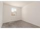 Bright bedroom with tile flooring and a window letting in natural light at 11615 W Beck Ave, Youngtown, AZ 85363