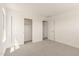 Bright bedroom with sliding closet doors, plush carpet, and great natural light at 11615 W Beck Ave, Youngtown, AZ 85363