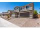 Charming two-story home with a two-car garage, brick driveway, and manicured landscaping at 11615 W Beck Ave, Youngtown, AZ 85363