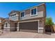 Attractive two-story house with a spacious two-car garage and well-maintained front yard at 11615 W Beck Ave, Youngtown, AZ 85363