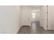 Bright foyer with tile flooring, white door, and open view into the home at 11615 W Beck Ave, Youngtown, AZ 85363