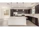 Beautiful kitchen featuring stainless steel appliances, a large island, and stylish pendant lighting at 11615 W Beck Ave, Youngtown, AZ 85363