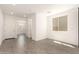 Bright living room features tile floors, white walls, and lots of natural light at 11615 W Beck Ave, Youngtown, AZ 85363