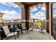 Relaxing outdoor balcony features comfortable seating area with lush green plants and beautiful views at 11640 N Tatum Blvd # 3048, Phoenix, AZ 85028