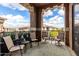Relaxing outdoor balcony features comfortable seating area with lush green plants and beautiful views at 11640 N Tatum Blvd # 3048, Phoenix, AZ 85028