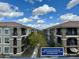 Balcony view of condo complex and pool with a path to spa/fitness center just steps away at 11640 N Tatum Blvd # 3048, Phoenix, AZ 85028