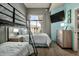 Charming bedroom with bunk beds, a chest of drawers, a TV and luxury vinyl plank flooring at 11640 N Tatum Blvd # 3048, Phoenix, AZ 85028