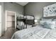 Cozy bedroom with a bunk bed and queen bed featuring stylish bedding and modern decor at 11640 N Tatum Blvd # 3048, Phoenix, AZ 85028
