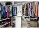 Walk-in closet with custom shelving, multiple hanging racks and a dresser at 11640 N Tatum Blvd # 3048, Phoenix, AZ 85028