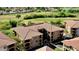Beautifully landscaped community near golf course with multi-story condo buildings and tile roofs at 11640 N Tatum Blvd # 3048, Phoenix, AZ 85028