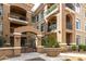 Beautiful building exterior with arched entryway, potted plants, and well-maintained landscaping at 11640 N Tatum Blvd # 3048, Phoenix, AZ 85028