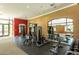 Bright gym featuring strength training equipment, rubber flooring, and a large mirror for optimal workouts at 11640 N Tatum Blvd # 3048, Phoenix, AZ 85028