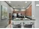 Well-lit kitchen with granite countertops, stainless steel appliances, and a breakfast bar with seating at 11640 N Tatum Blvd # 3048, Phoenix, AZ 85028