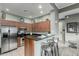 Modern kitchen features stainless steel appliances, granite countertops, and breakfast bar seating at 11640 N Tatum Blvd # 3048, Phoenix, AZ 85028