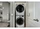 Laundry closet featuring a stacked washer and dryer at 11640 N Tatum Blvd # 3048, Phoenix, AZ 85028