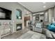 Open concept living room includes stylish decor, a fireplace, and seamless flow into the kitchen at 11640 N Tatum Blvd # 3048, Phoenix, AZ 85028
