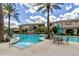 Beautiful community pool with lounge seating and palm trees, perfect for relaxation at 11640 N Tatum Blvd # 3048, Phoenix, AZ 85028