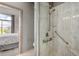 Bathroom shower with safety bar, multiple showerheads, and next to the main bedroom at 11640 N Tatum Blvd # 3048, Phoenix, AZ 85028
