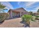 Landscaped backyard with covered patio provides an excellent space to relax and enjoy outdoor living at 123 S Lucia Ln, Casa Grande, AZ 85194