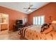 Comfortable bedroom featuring shutters, southwestern decor, and an en-suite bathroom at 123 S Lucia Ln, Casa Grande, AZ 85194
