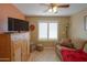 Comfortable bedroom with natural light, shuttered windows, and cozy seating area, creating a relaxing and inviting atmosphere at 123 S Lucia Ln, Casa Grande, AZ 85194