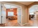 View of the bedroom with a ceiling fan, seating, and terracotta walls at 123 S Lucia Ln, Casa Grande, AZ 85194