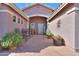 Inviting courtyard with brick pavers, potted plants, and seating area perfect for outdoor relaxation and entertaining at 123 S Lucia Ln, Casa Grande, AZ 85194