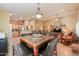 Open concept floor plan flows from the dining area to the living room, maximizing space and light at 123 S Lucia Ln, Casa Grande, AZ 85194