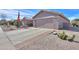 Well-maintained single-story house featuring a spacious two-car garage and desert landscaping for low maintenance at 123 S Lucia Ln, Casa Grande, AZ 85194