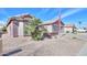Charming single-story home with neutral stucco, desert landscaping, and a two-car garage in a quiet residential neighborhood at 123 S Lucia Ln, Casa Grande, AZ 85194