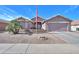 Charming single-story home with neutral stucco, desert landscaping, and a two-car garage in a quiet residential neighborhood at 123 S Lucia Ln, Casa Grande, AZ 85194