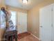 Inviting foyer with rustic wood accents, tile flooring, and a front door that welcomes guests at 123 S Lucia Ln, Casa Grande, AZ 85194