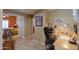 Inviting office space featuring a cozy work area and easy access to the comfortable bedroom, perfect for focused productivity at 123 S Lucia Ln, Casa Grande, AZ 85194