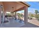 Enjoy a covered patio with outdoor dining and a grill, perfect for entertaining and enjoying the backyard at 123 S Lucia Ln, Casa Grande, AZ 85194