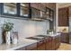 Close-up of a modern kitchen featuring a marble countertop, stainless steel appliances, and custom cabinetry at 12652 E Troon Vista Dr, Scottsdale, AZ 85255