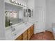 Bathroom with dual sinks and a large mirror at 12914 W Wilshire Dr, Avondale, AZ 85392